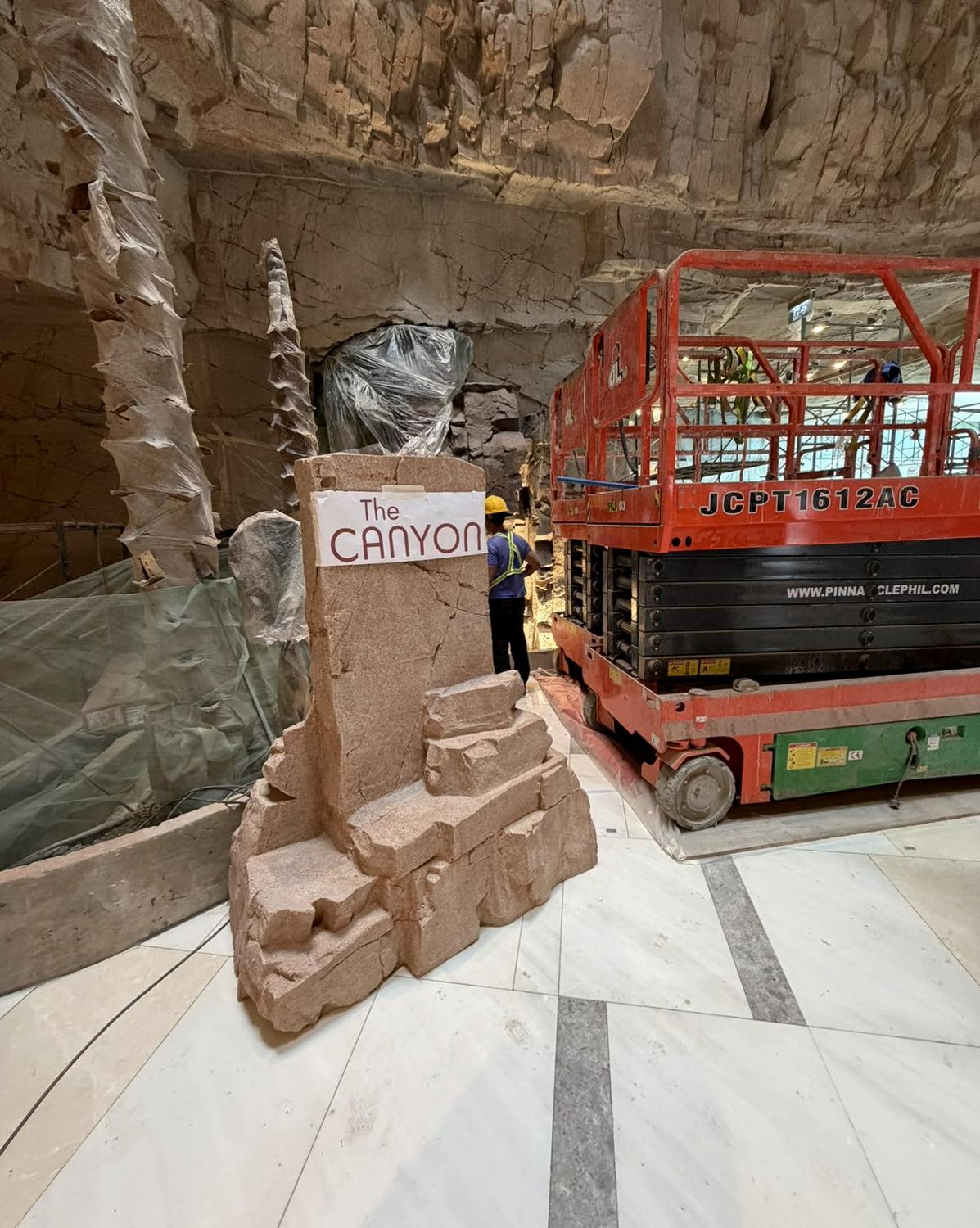 The Canyon mock-up taped to the rock monolith during fit-out
