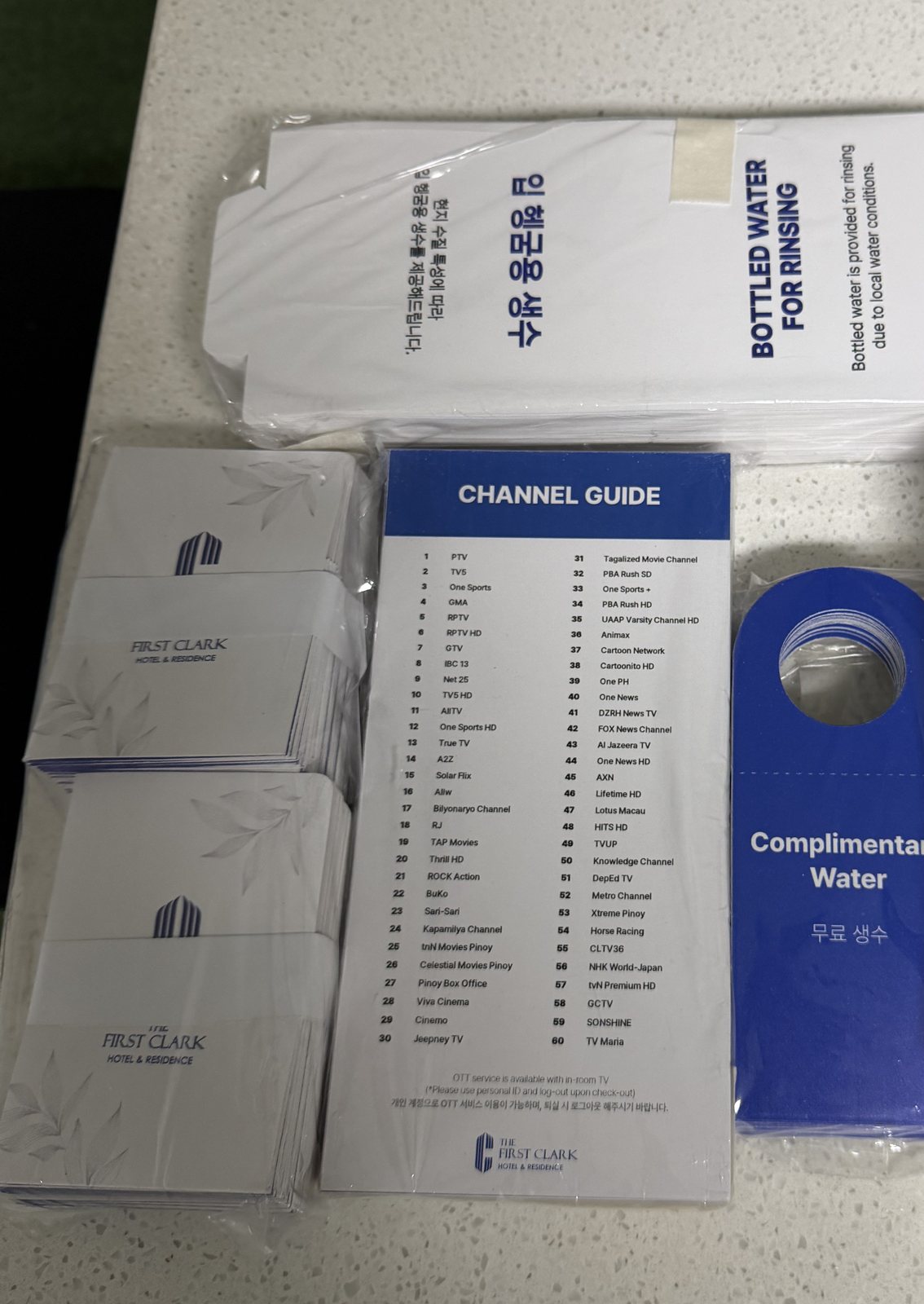 Printed channel guide, water door hanger and room cards for First Clark
