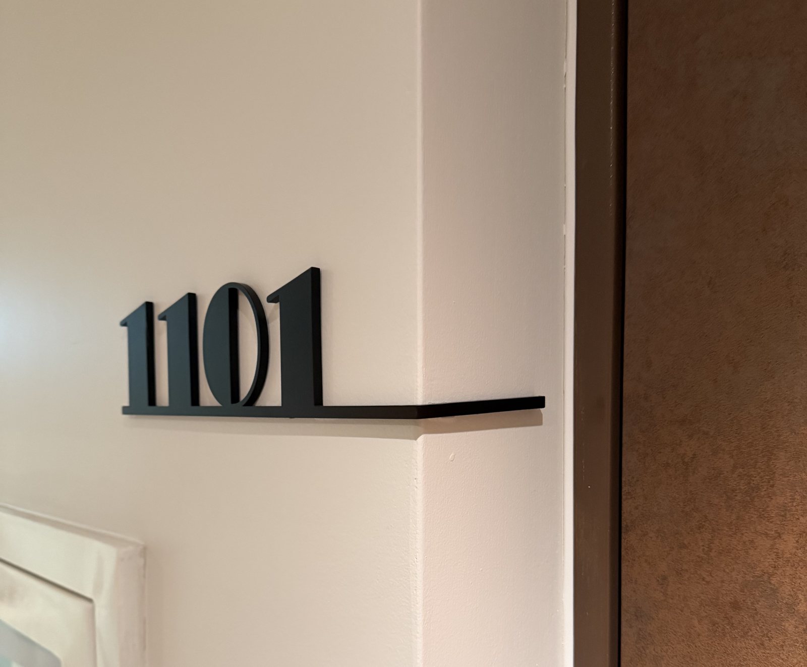 Room number 1101 with underline beside the door