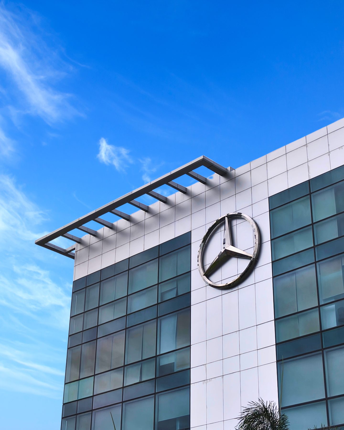 Mercedes-Benz facade emblem against the sky