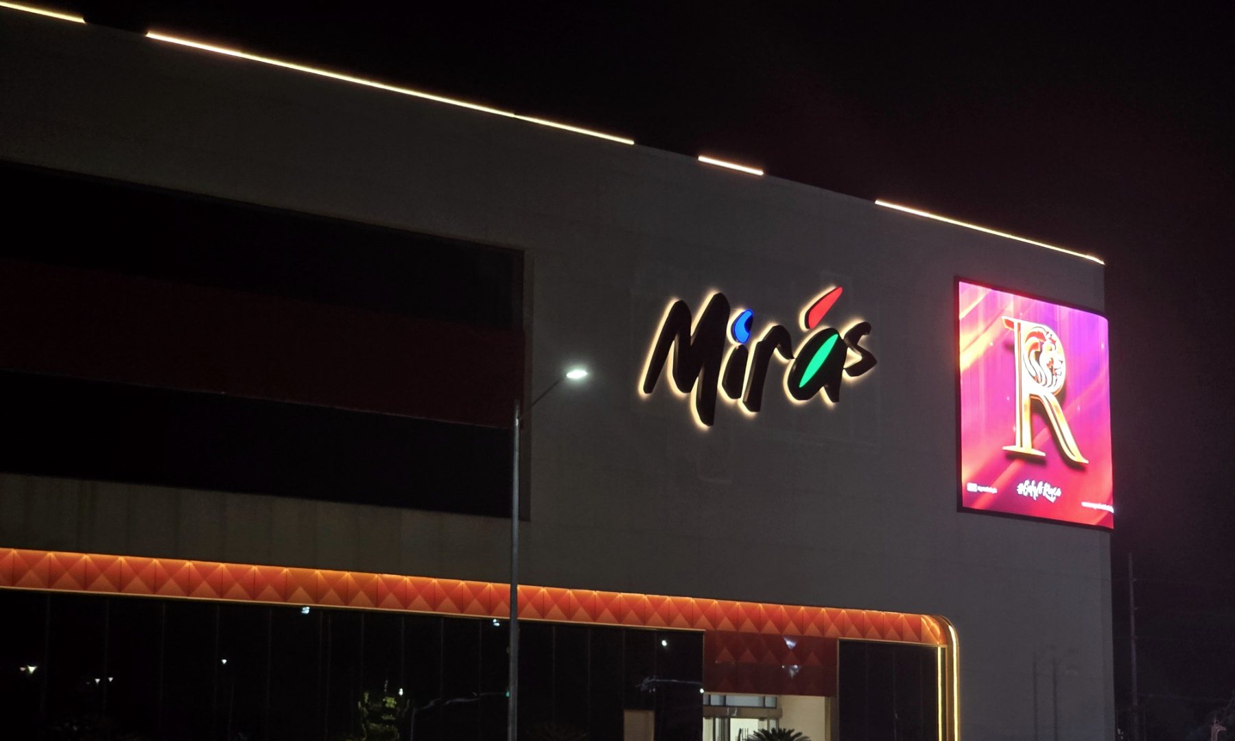Mirás Mall halo-illuminated facade signage at night, Clark